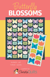 Front cover of Butterfly Blossoms Quilt Pattern by Christa Watson of Christa Quilts showing graphic images of 2 sizes and 2 colorways of quilts.