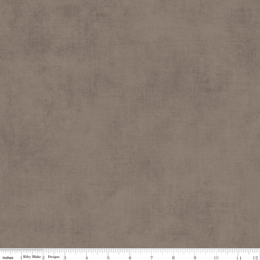 Riley Blake Designs C200-Pebble Shades fabric featuring a warm grey or greige tone-on-tone mottled texture.