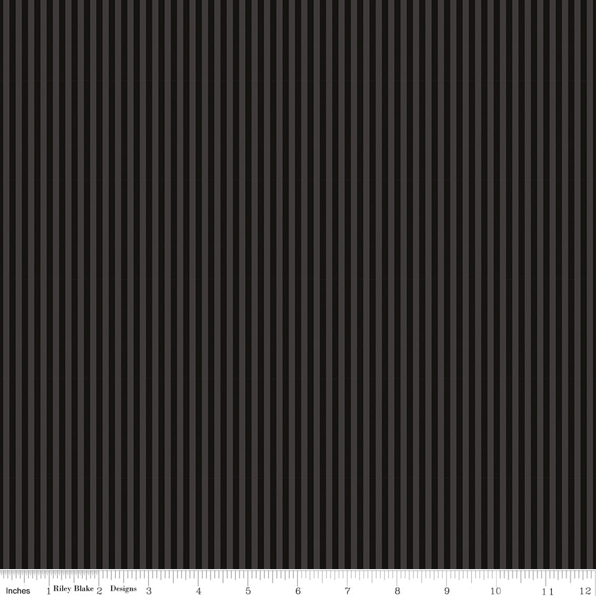 Close-up of Riley Blake Designs C500-Black fabric featuring thin 1/8 inch tone-on-tone vertical black and dark grey stripes with a measurement ruler.