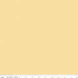 Close-up of Riley Blake Designs Sunshine yellow fabric featuring a tiny tone-on-tone geometric square pattern with a 12-inch ruler for scale.