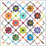Image of Daisy Chain quilt featuring pattern by Christa Quilts and batik fabric by Riley Blake Designs.