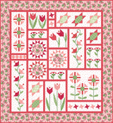 Digital image of the finished quilt for 'Petal Patch' quilt pattern by Jill Finley, showing a completed rectangular throw quilt with traditionally pieced geometric star blocks and colorful flower blocks featuring delicate applique centers.