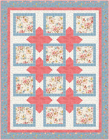 Quilt kit with floral fabrics by Lisa Audit for Riley Blake Designs features coral, blue and cream